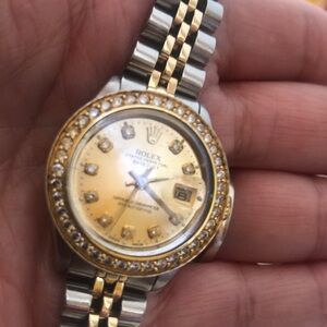 Authenticated Ladies date just Rolex 14 k gold & stainless with diamonds bezel
